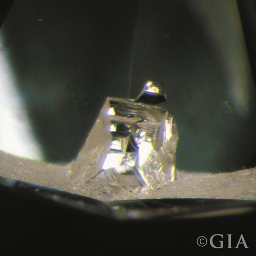 A photo of an indented natural,  a diamond inclusion to avoid.