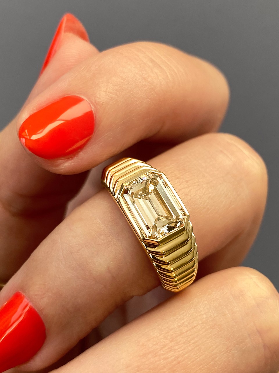 Custom frank darling radiator ring in yellow gold set with a 2 carat lab grown emerald cut diamond