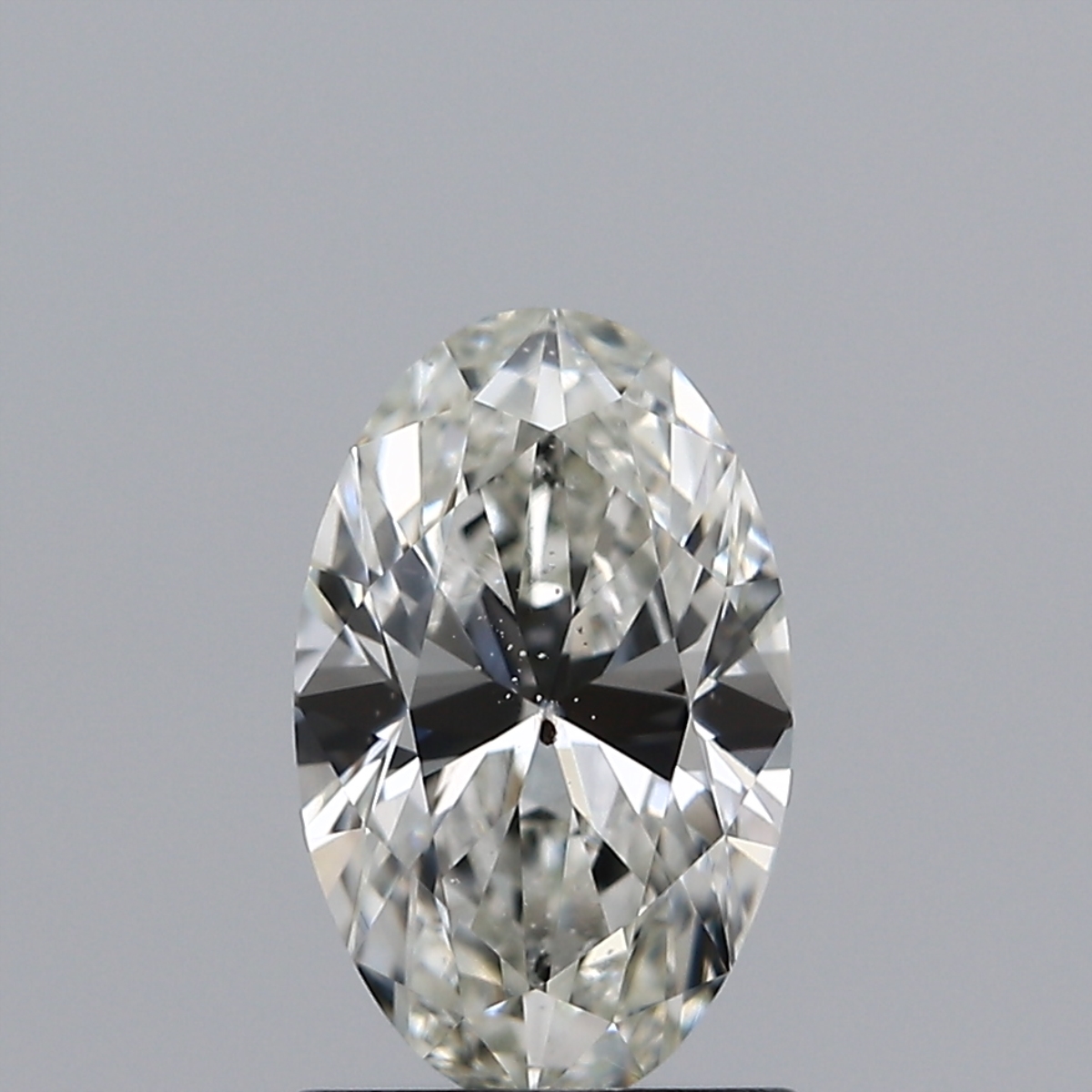 Oval diamond with a bad black bow tie