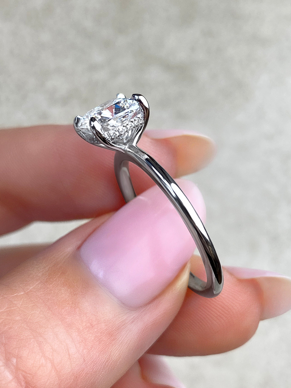 French set hidden halo engagement ring platinum