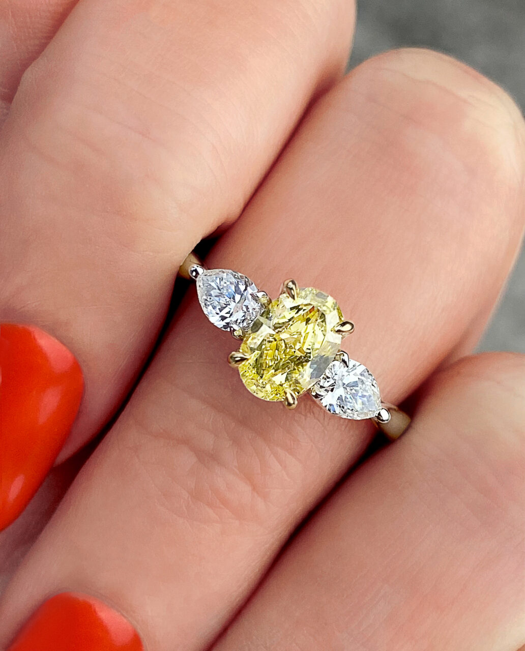 Frank Darling custom fancy yellow diamond oval three stone ring.