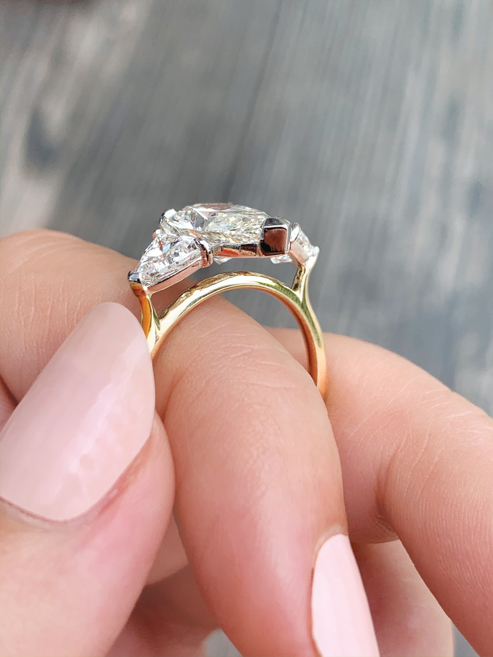 Diamond ring with on sale triangle side stones