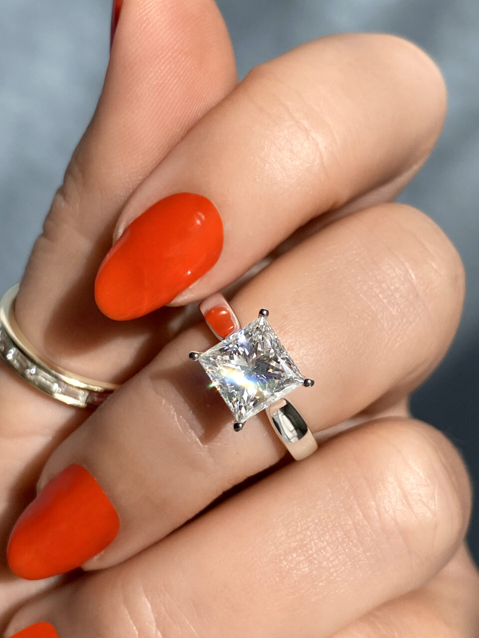 princess cut claw prong solitaire with cathedral shoulders platinum ethical engagement ring